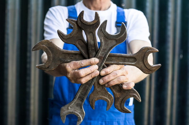 Mechanic holding a wrench. - Photo, Image
