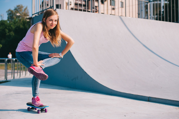 Beautiful girl with skateboard - Фото, зображення