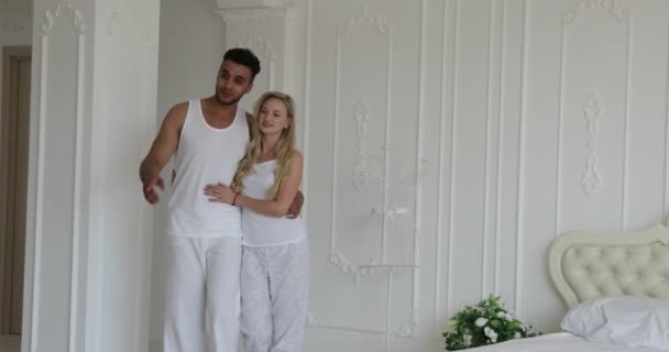 Young couple viewing beautiful modern apartment mixed race man woman - Metraje, vídeo