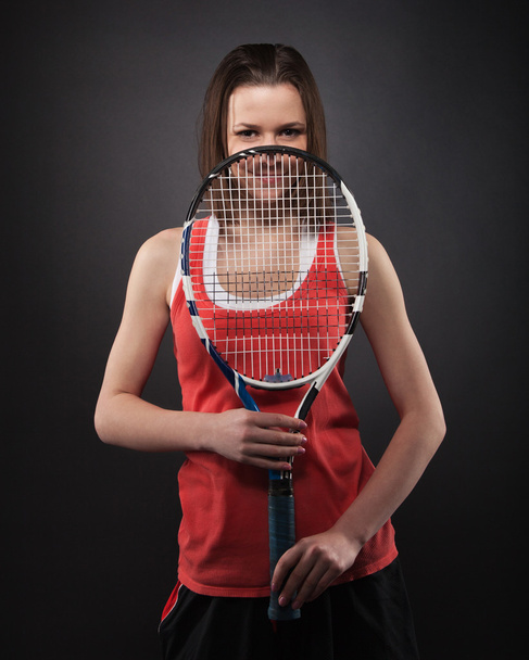 Portrait of sporty girl tennis player with racket - Фото, изображение