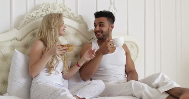 young couple drink coffee in bed, happy smile woman man lovers, love romantic morning - Video
