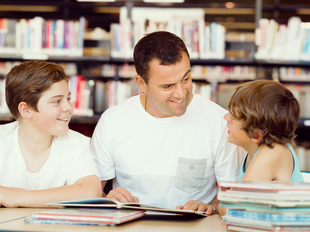 Father with sons in library - Photo, Image