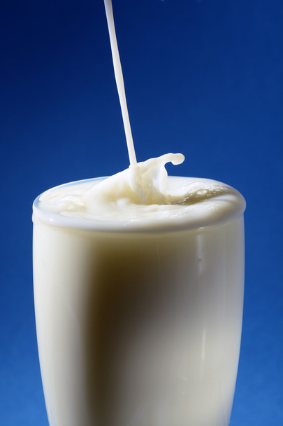 Pouring milk in a glass - Foto, Imagem