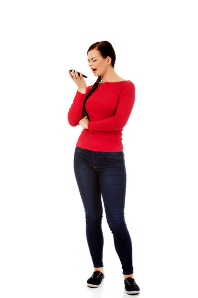 Young student woman yelling to the mobile phone - Photo, image