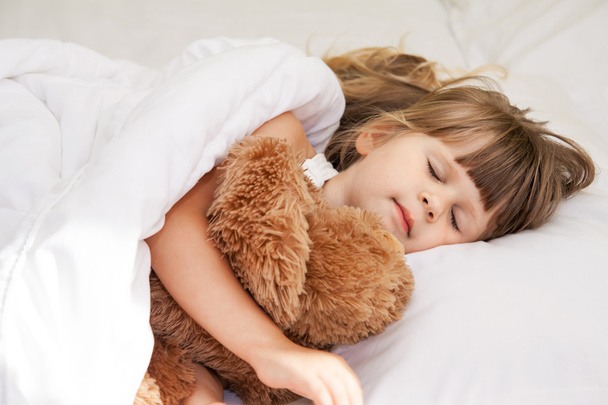 Little girl sleep in bed - Фото, зображення