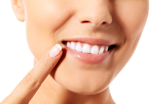 Dental health concept - beautiful woman pointing to her teeth - Фото, зображення
