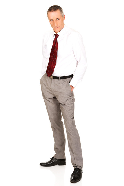 Businessman with hands in pockets - Photo, Image