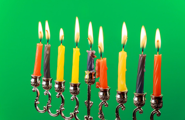 Hanukkah menorah with candles green background isolation - Foto, afbeelding