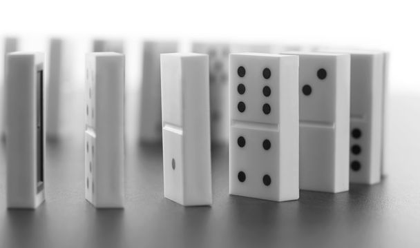 Dominoes standing on gray background - Foto, Imagen