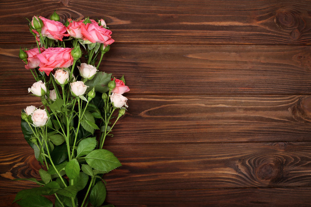 Fresh flowers on  wooden background - Fotó, kép