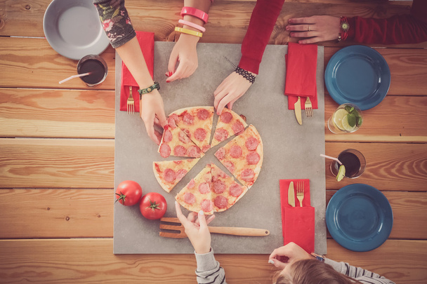 Group of people eating pizza. - Φωτογραφία, εικόνα