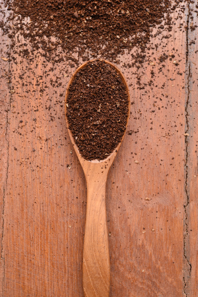 Ground coffee in wooden spoon  - Zdjęcie, obraz