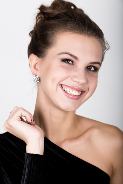 close-up portrait of a sexy beautiful woman in little black fashion dress, smiling - Фото, изображение