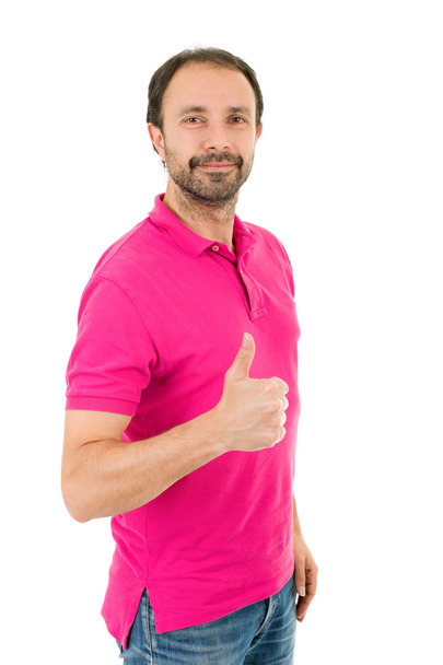 Young casual man going thumbs up, isolated on white background - Photo, Image