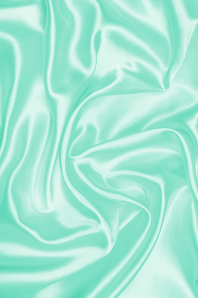 Smooth elegant green silk or satin texture as background - Foto, afbeelding