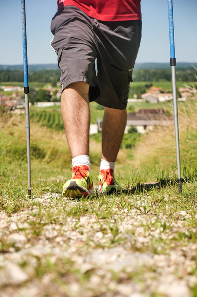 Man walking on sidewalk, sport shoes - Foto, Imagen