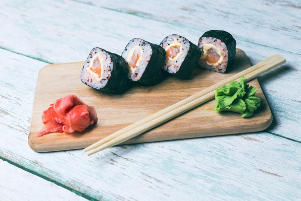 Sushi set on a wooden tray - Photo, Image