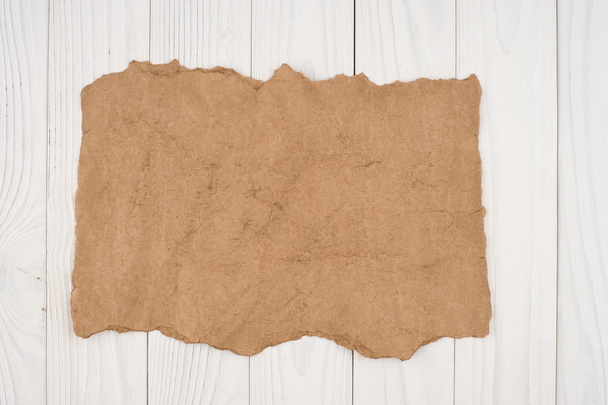 Crumpled paper on a white wooden background. - Fotó, kép