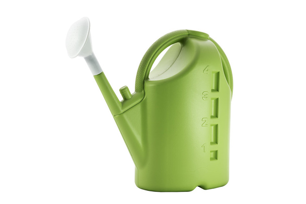 Green plastic watering can isolated on white background.  - 写真・画像