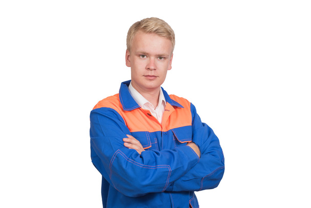 schönes Porträt eines erfolgreichen Arbeiters in blauer Uniform isoliert auf weißem Hintergrund - Foto, Bild