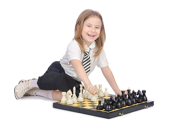 Cute girl playing chess on white - Fotó, kép