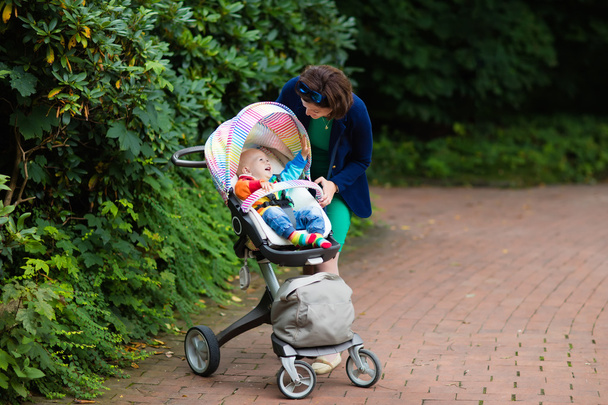 Mom and baby in a stroller - Photo, Image