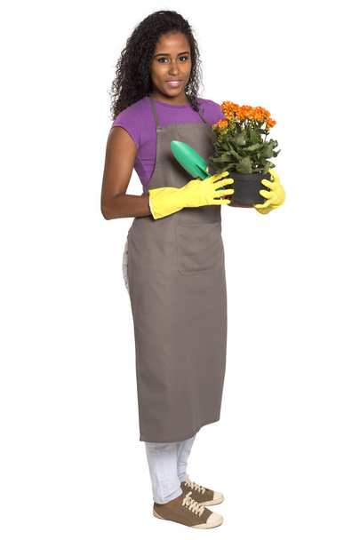 Beautiful African girl gardener with flower isolated on white background - Zdjęcie, obraz
