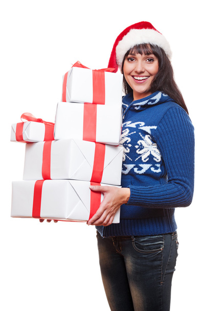 Woman holding christmas gifts - Foto, afbeelding