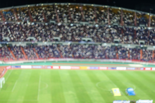 rozostřeného pozadí fotbal nebo fotbal stadionu za soumraku, Thajsko - Fotografie, Obrázek