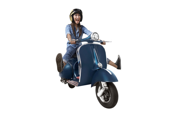 Asian woman riding scooter - Fotografie, Obrázek