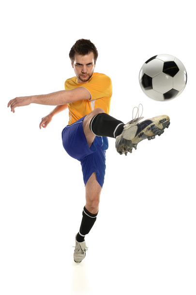 Soccer Player Kicking Ball - Foto, afbeelding