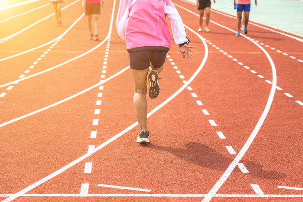 athlete warm up on running track at the stadium - Photo, Image