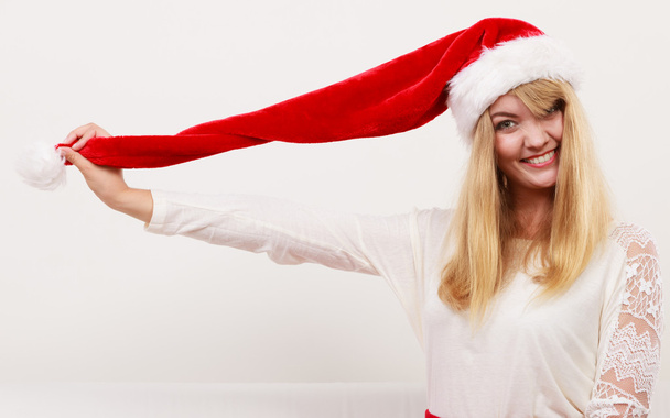 Happy cute woman in santa helper hat. Christmas. - 写真・画像