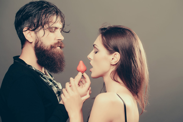 sexy couple eating red strawberry - Fotoğraf, Görsel