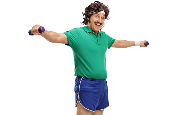 Sportsman exercising with dumbbells - Φωτογραφία, εικόνα