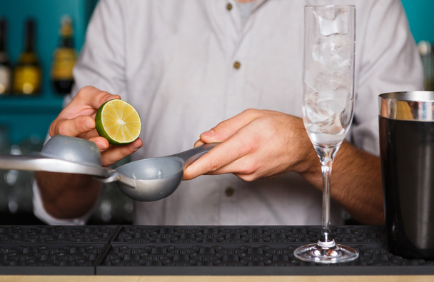 Barmans hands making cocktail with egg yolk - Photo, Image