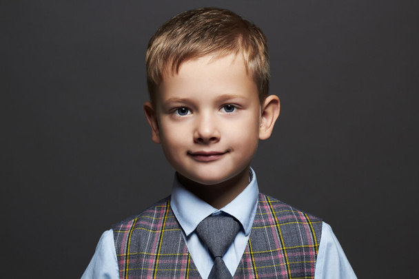 fashionable little boy.smiling funny child in suit and tie - Fotó, kép