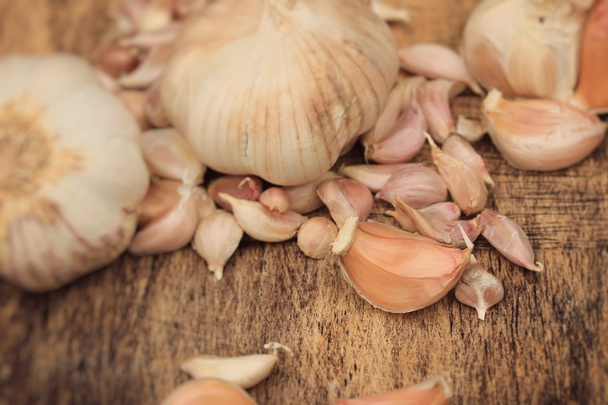 Garlic on wood background - Photo, Image