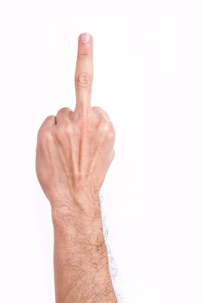 Man's hand giving middle finger gesture, hairy arm - Photo, Image
