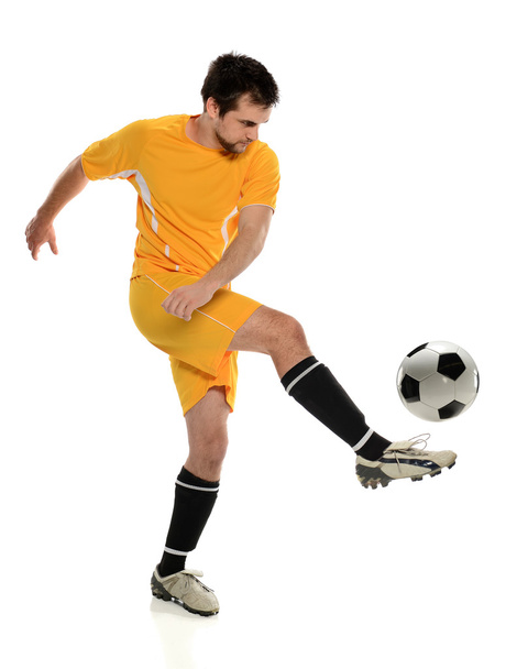 Soccer Player Kicking Ball - 写真・画像