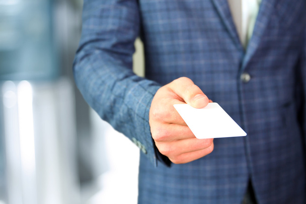 Close up portrait of  businessman  giving  a  business card - Photo, Image