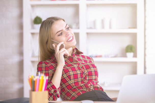 Girl talking on phone and workplace - Фото, зображення
