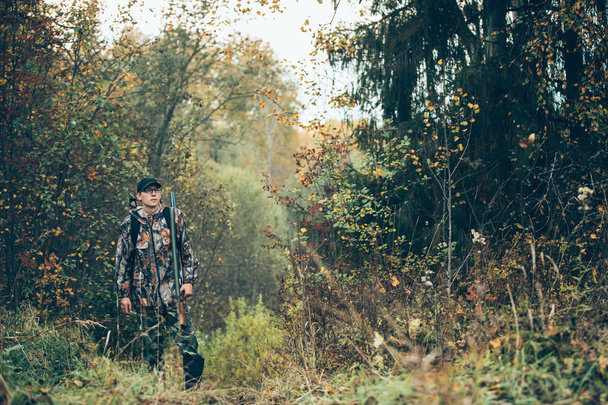 Male hunter in the forest - Fotoğraf, Görsel