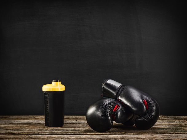 Boxing gloves on wooden background - Fotografie, Obrázek