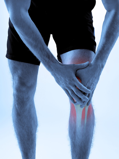 Knee pain on gray - Foto, immagini