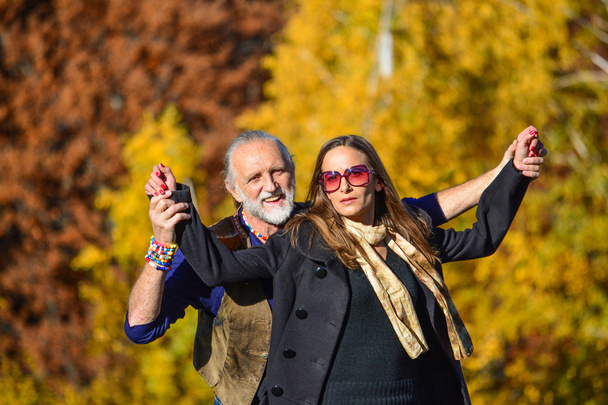 Happy couple on autumn mountain meadow - Valokuva, kuva
