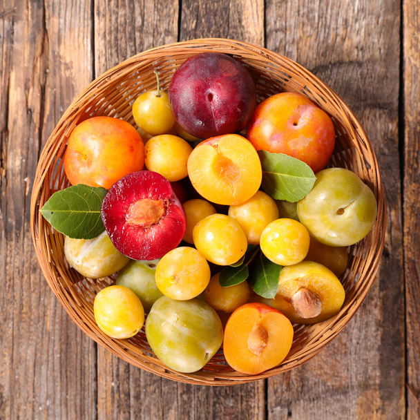 assortment of colorful plums - Фото, зображення