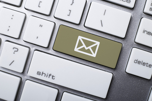 Email and online communication concepts, with email symbol on the keyboard. - Photo, Image