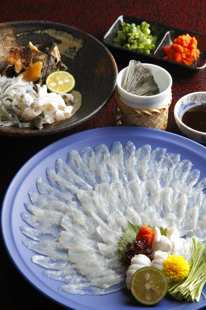 Wakasa blowfish or fugu thin fillet in big platter with lemon, s - Photo, Image
