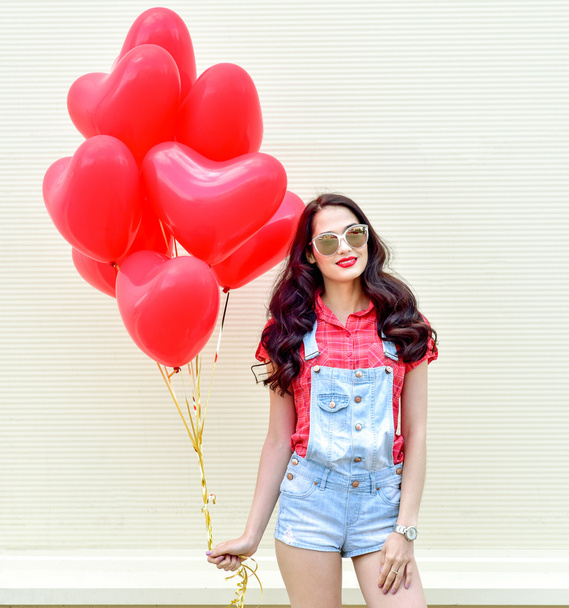 Woman with red heart balloons - Photo, image